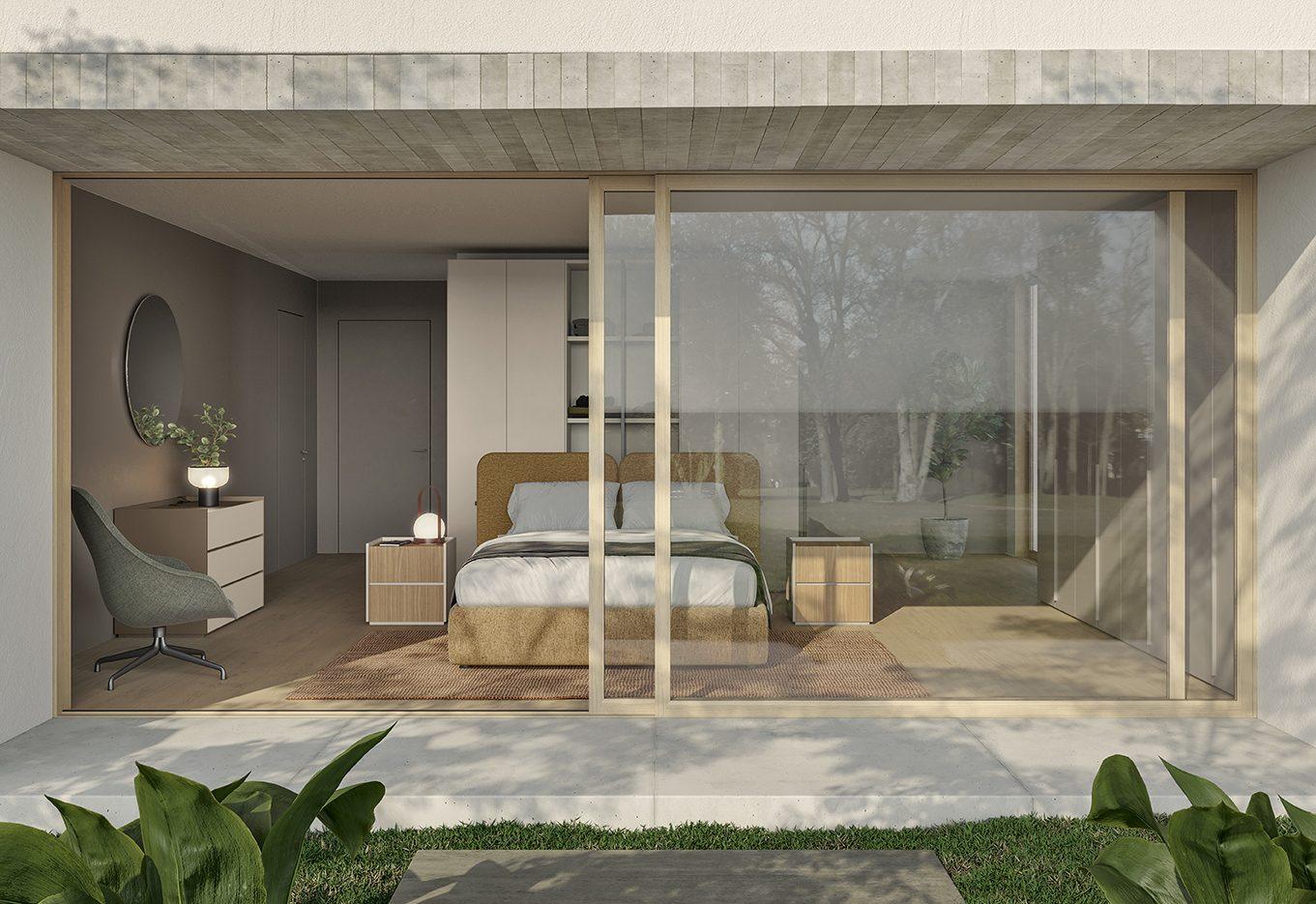 Camera da letto affacciata su ampia vetrata scorrevole con vista giardino, testata imbottita in tessuto boucle giallo senape e comodini in legno chiaro
